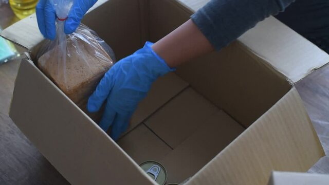 Volunteers with donation boxes for the needy and provide essential supplies to help during the plague Covid-19.