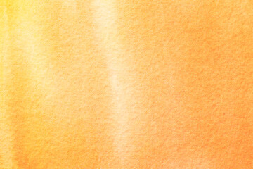 Abstract art background light orange and yellow colors. Watercolor painting on canvas with soft golden gradient.