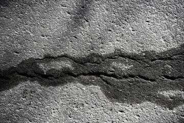 asphalt in cracks texture / abstract background cracks on asphalt road