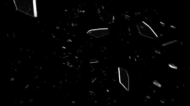 Glass breaking in slow motion on black background. 
Hammer breaking Pane of Glass against Black Background, Slow Motion.