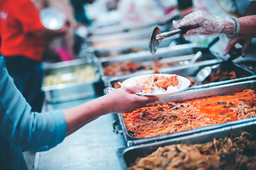 Volunteers Share Food to the Poor to Relieve Hunger : Charity food concept