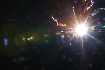 Abstract imitation sun starlight distant galaxy on a black background.