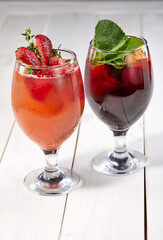summer cocktail with fresh berries and fruits