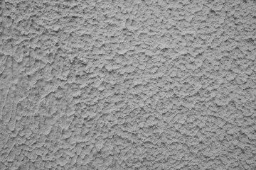 evocative black and white image of plastered wall texture