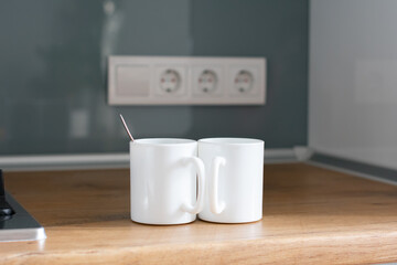 White Cups of coffee or tea on the table