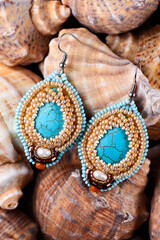 Turquoise earrings with beads on sea shells