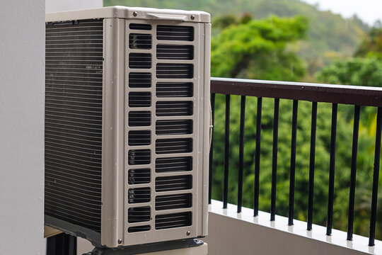air conditioning external unit split system installed on the balcony cooling office space