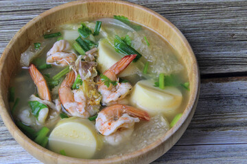 Tube tofu with shrimp and vegetables are the foods that Thai people tend to eat often put in wooden cups.