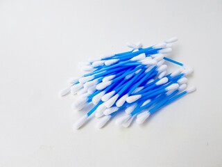 Ear sticks with blue plastic on a white background. Personal hygiene and self-care. Cosmetology and medicine.