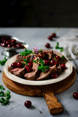 Roast beef with cherry sauce.style rustic.