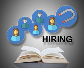 Hiring concept above a book