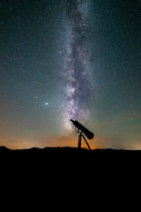 milky way and starry sky with telescope