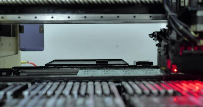 Automatic SMD pick and place machine during work - assembly of computer print