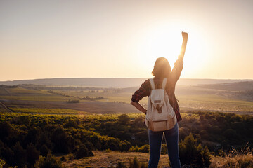 Asian woman traveler on the viewpoint over sunset time