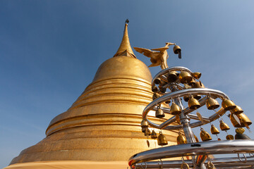 The The Golden Mount at Wat Saket in Bangkok,Thailand, is the famous travel landmark with blue sky background.