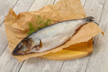Salted herring over the wooden board