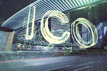 Multi exposure of cryptocurrency theme hologram drawing and city veiw background. Concept of...
