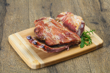 Smoked pork ribs over the wooden background