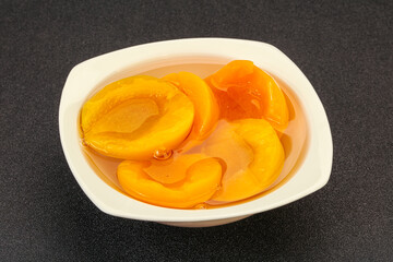 Marinated peaches fruit in the bowl