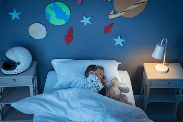 Boy sleeping and dreaming a future in the space - Powered by Adobe
