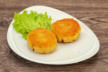 Vegan cuisine - Potato cutlet in the plate