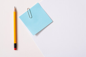 Blank paper memo with clip on white background
