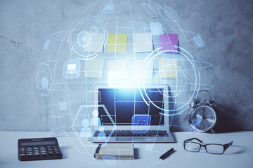 Computer on desktop with social network hologram. Double exposure. Concept of international people connections.
