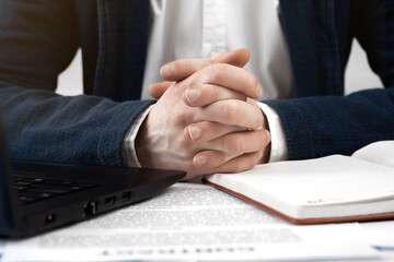 Cropped view of businessman works with financial papers at the table. Finance concept