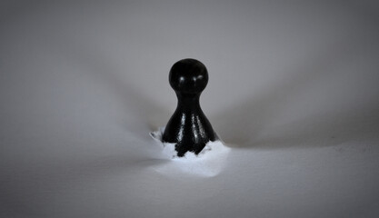 Black pawn breaking through white ground