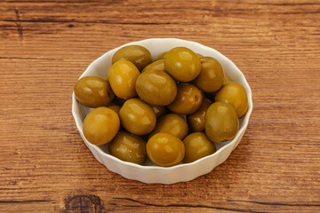 Green pickled olives in the bowl