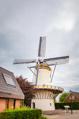 White windmill De Hoop near the city of Leiden in Benthuizen, South Holland in the Netherlands, Europe