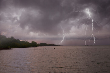 Strong lightning storm in the sea in monsoon season