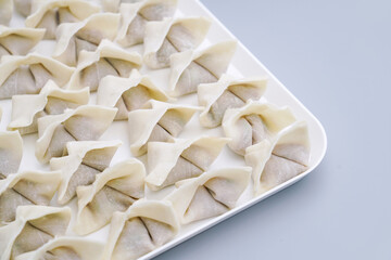 Traditional Chinese food wonton is placed on a white plate. The delicious wonton is on a plate.