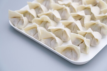 Traditional Chinese food wonton is placed on a white plate. The delicious wonton is on a plate.