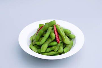 A traditional Chinese delicacy in solid color, boiled soybeans in brine. Chinese traditional food boiled soybean