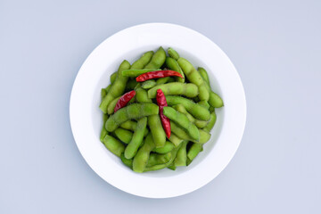 A traditional Chinese delicacy in solid color, boiled soybeans in brine. Chinese traditional food boiled soybean