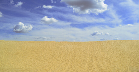 Beautiful wide landscape of sand and sky with clouds. Summer, desert