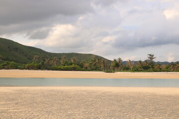 Small sand island in the middle of beach Beach