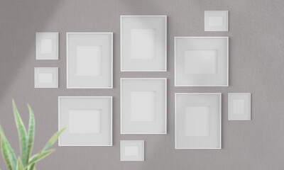 Collage of blank frames frames on a wall