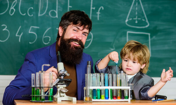 Start to create. small boy with teacher man. Wisdom. Back to school. son and father at school. Chemistry and physics biology. Flask in scientist hand with Test tubes - Powered by Adobe