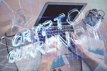 Blockchain theme hologram with man working on computer on background. Concept of crypto chain. Double exposure.