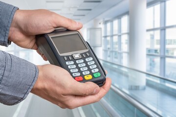 Payment terminal in hand of man