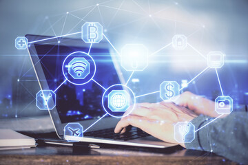 Social network theme hologram with businessman working on computer on background. Concept of world wide web. Multi exposure.