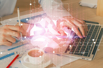 Businessman with computer background with brain theme hologram. Concept of brainstorm. Multi exposure.