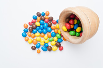 Colored candies filled with chocolate. On white background
