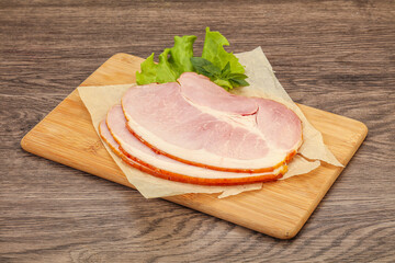 Sliced pork belly over board