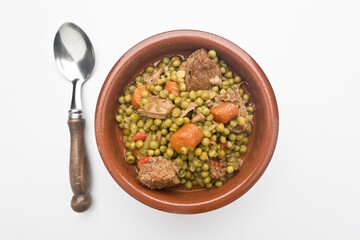 Peas, Pisum sativum, with stewed meat. With white background Asturias, Spain