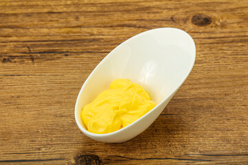 Natural cheese sauce in the bowl