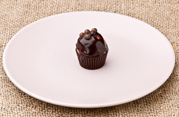 Fruit cake, small. On a pink plate. Asturias, Spain