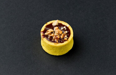 Fruit cake, small. On black background. Asturias, Spain